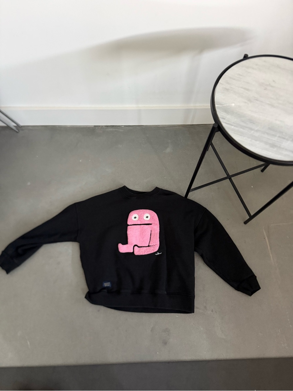 Black Sweatshirt with Pink Fuzzy Monster Graphic